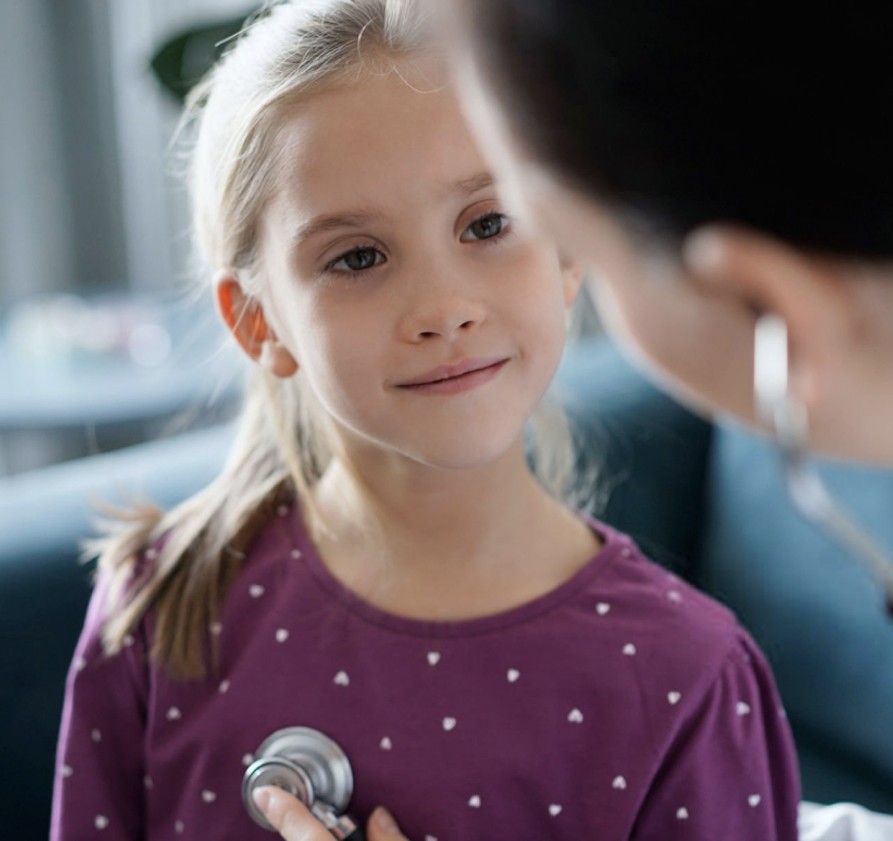 little girl staring at doctor
