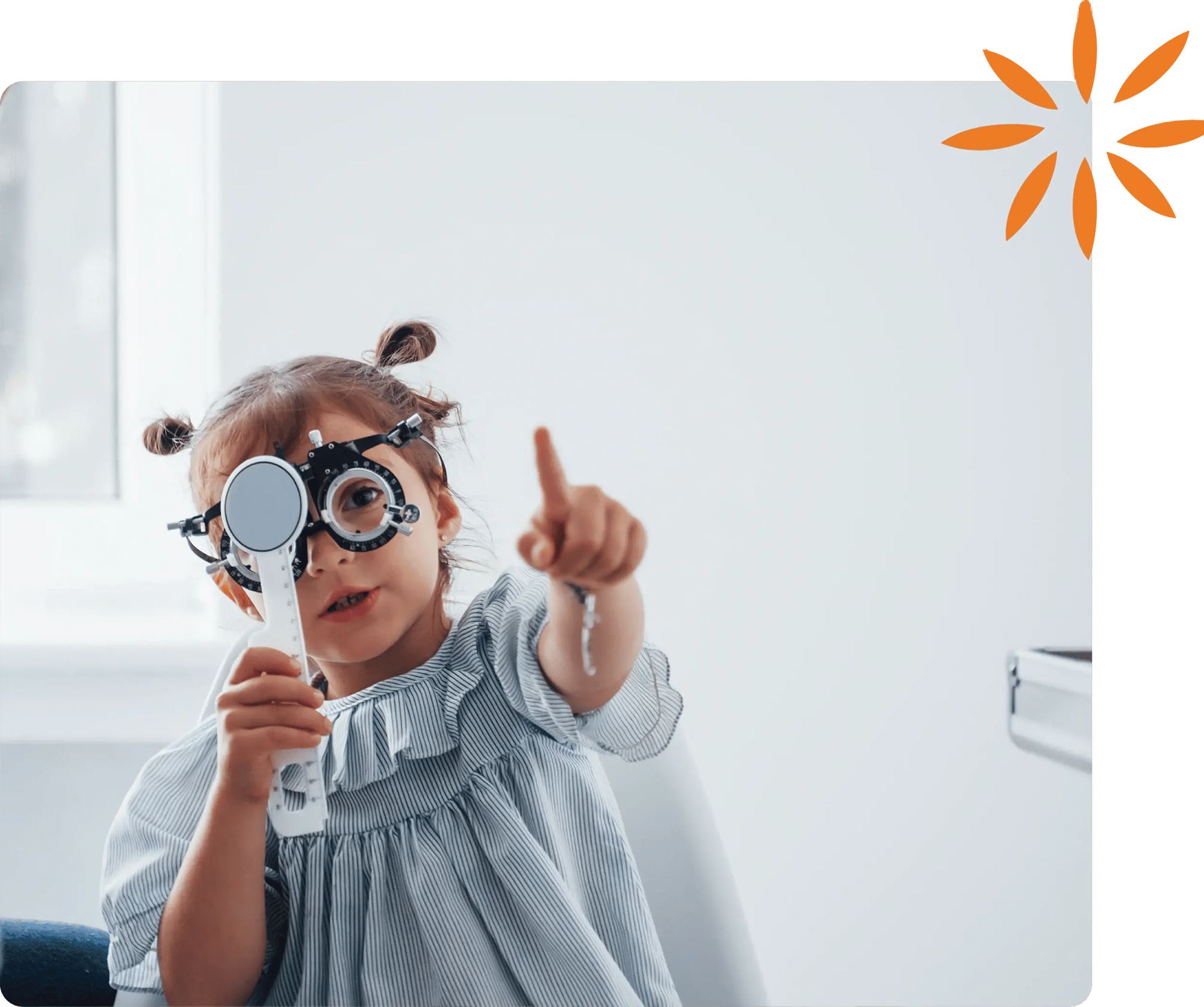 Little girl covering eye for vision test